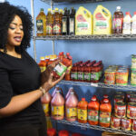 Nagwa Wankey holding container of spices